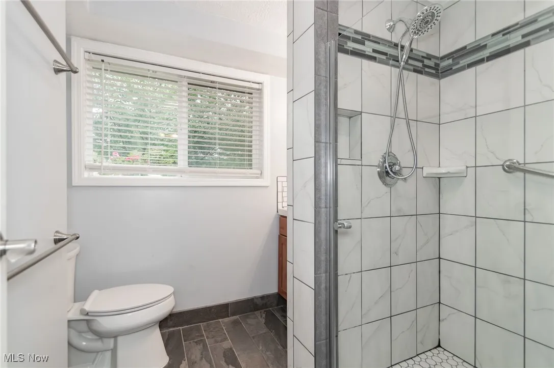 Full bathroom with a stall shower and vanity