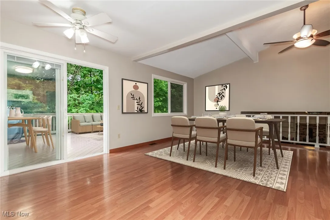 Dining room with a ceiling fan and wood finished floors