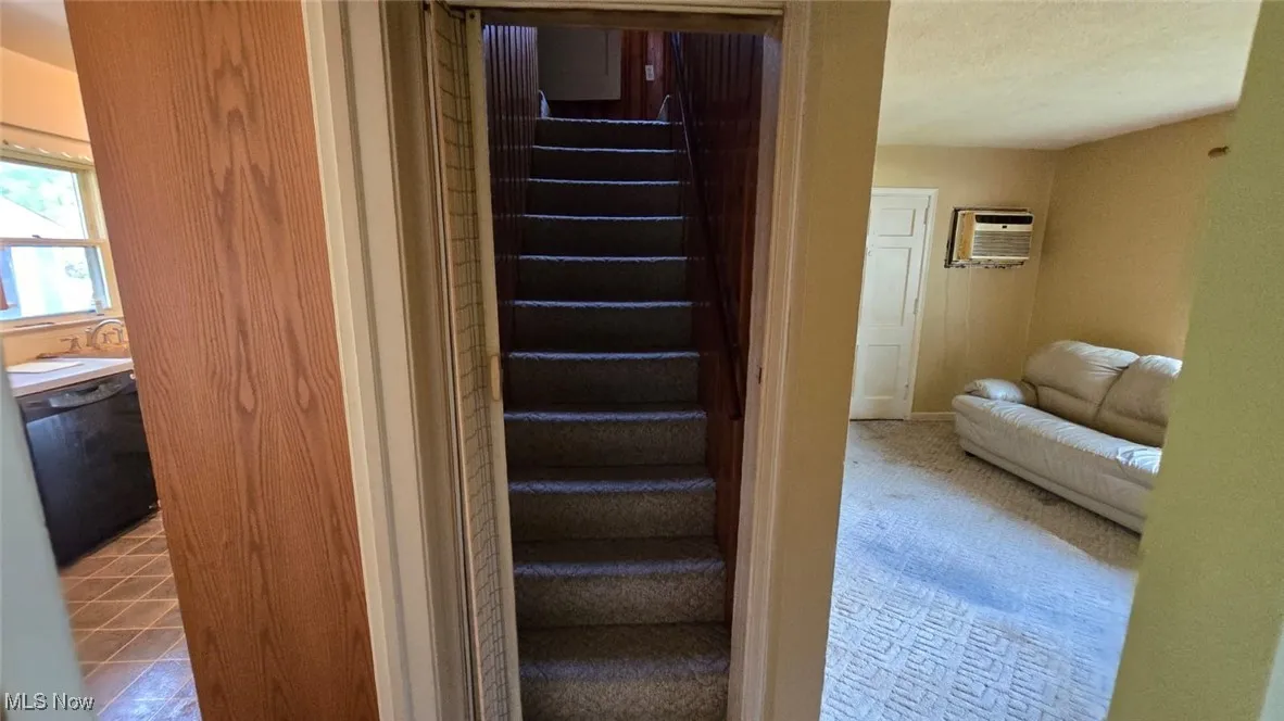 Staircase with an AC wall unit