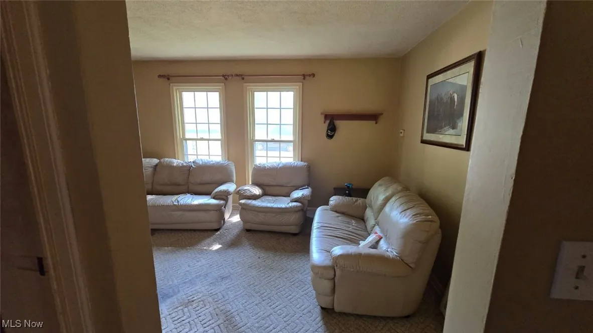 Sitting room with carpet floors