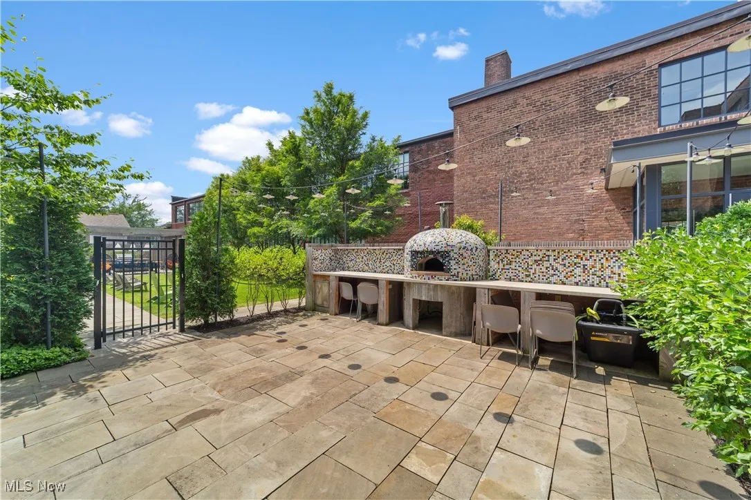 Pizza oven and patio area with sink and counter space for community use
