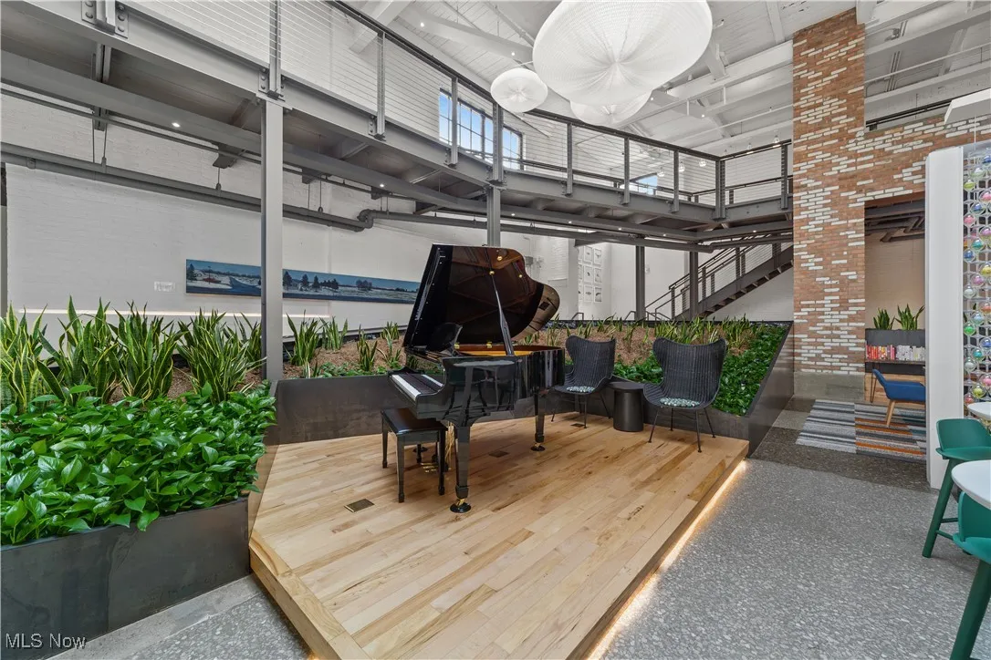 View of piano and indoor plants in community living space
