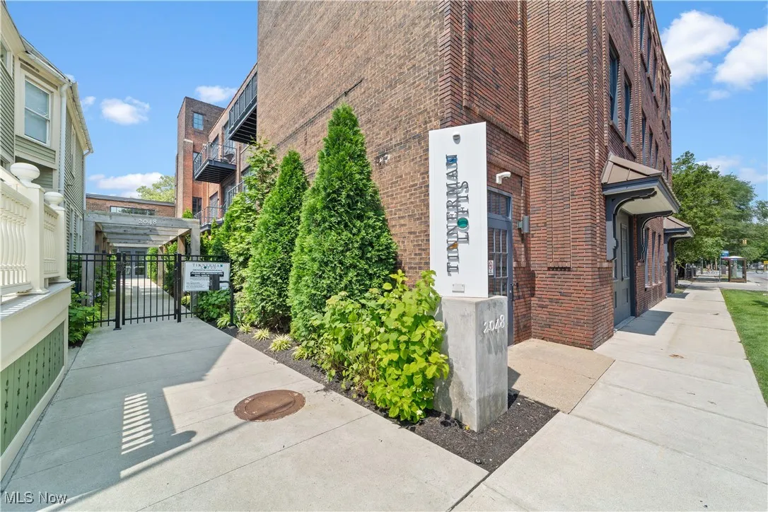 Main entry area with signage and gated access
