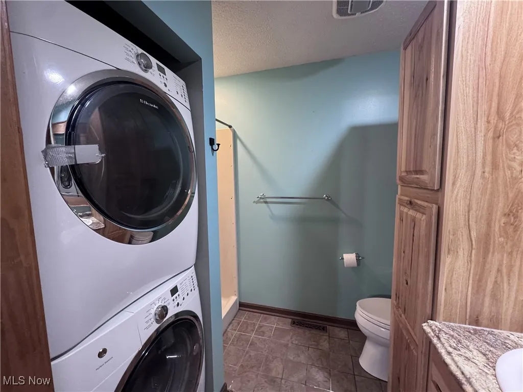 Master Bathroom with stacked washer / dryer