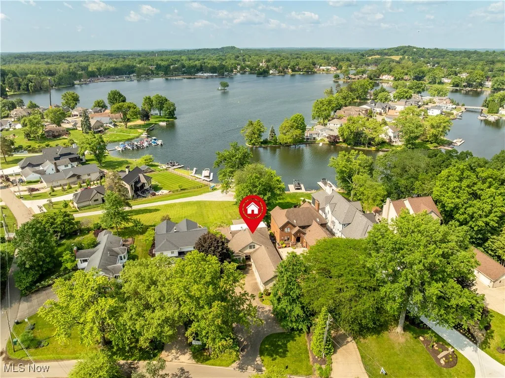 Aerial perspective of the home on the lake.