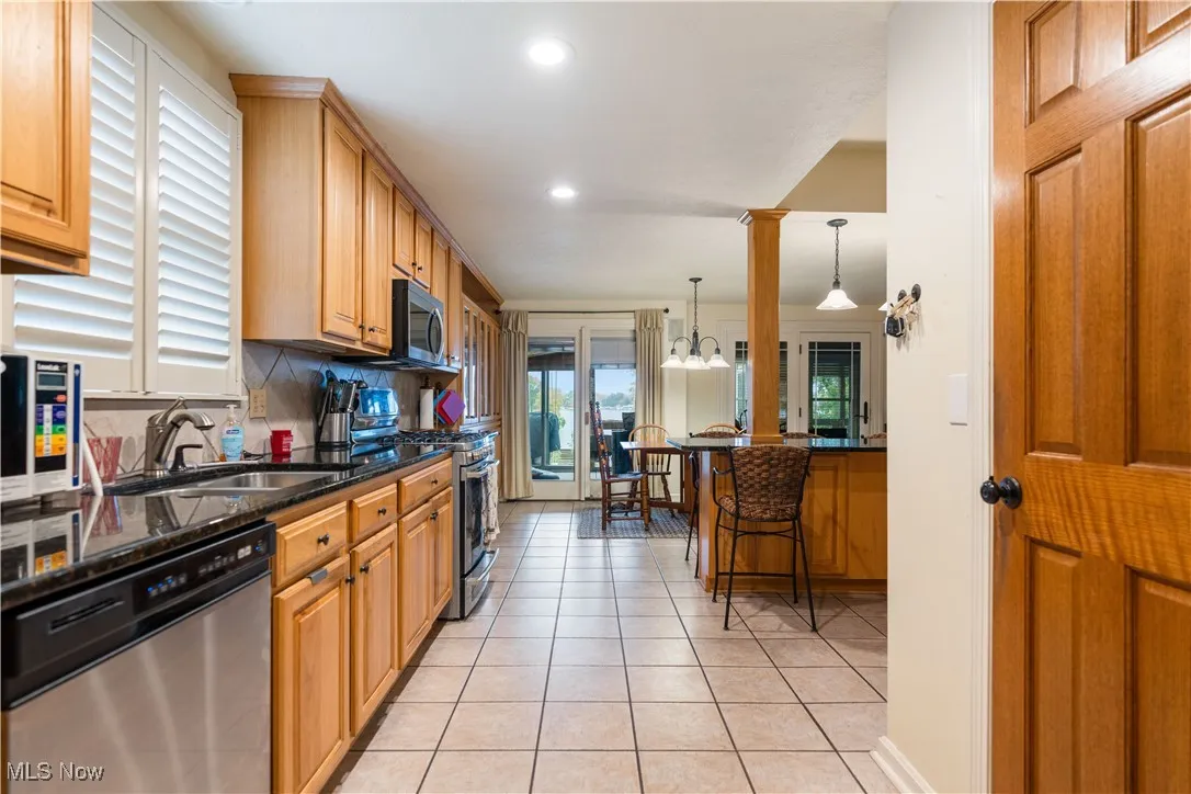 Stainless steel appliances in the kitchen.