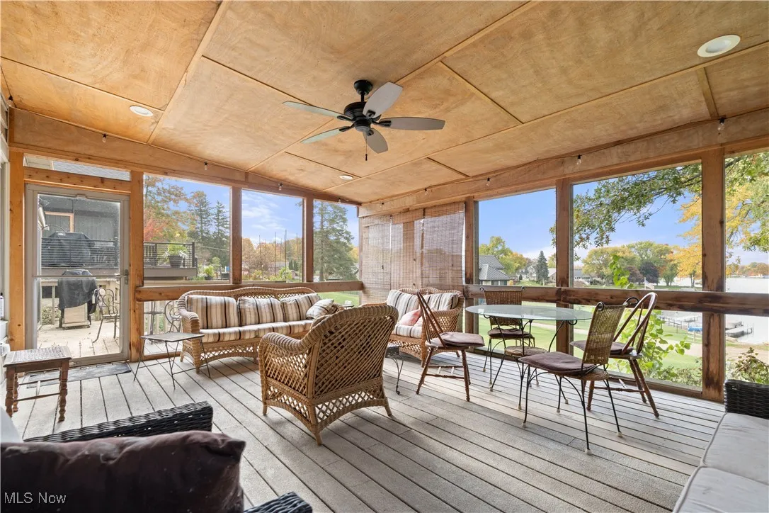 Screen porch with view of the lake.