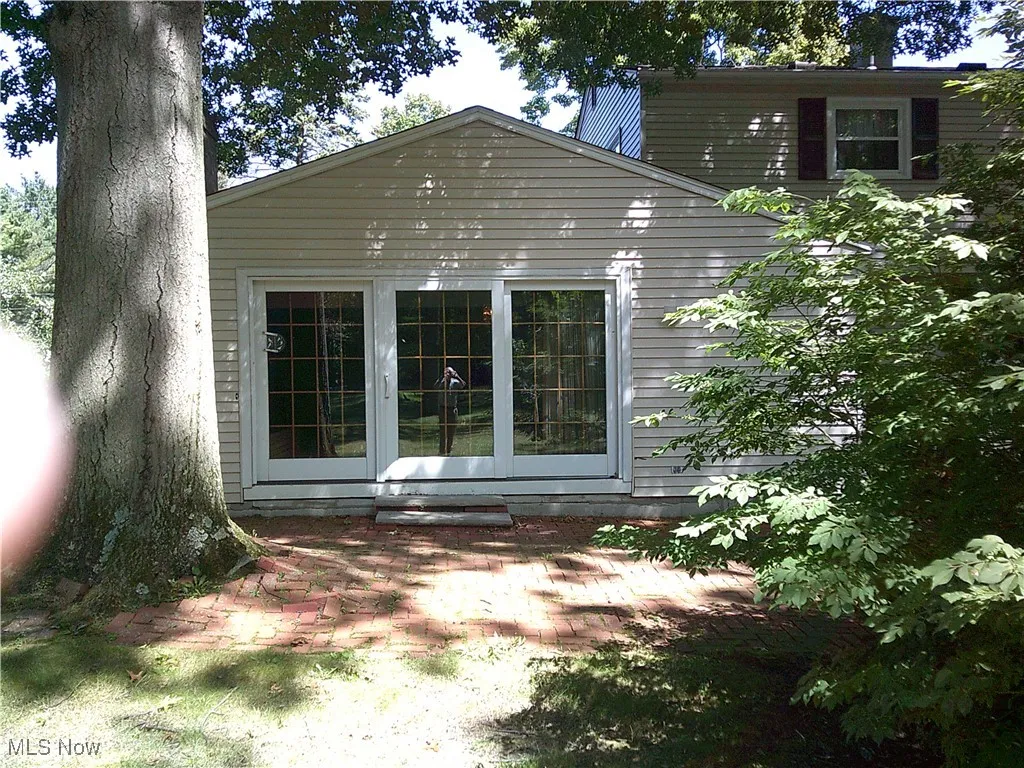 View of property exterior featuring a patio