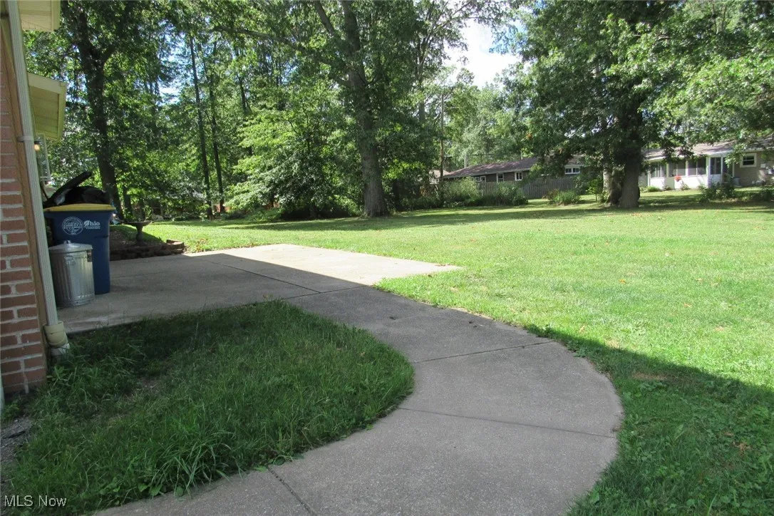 Spacious back and side yard with patio.