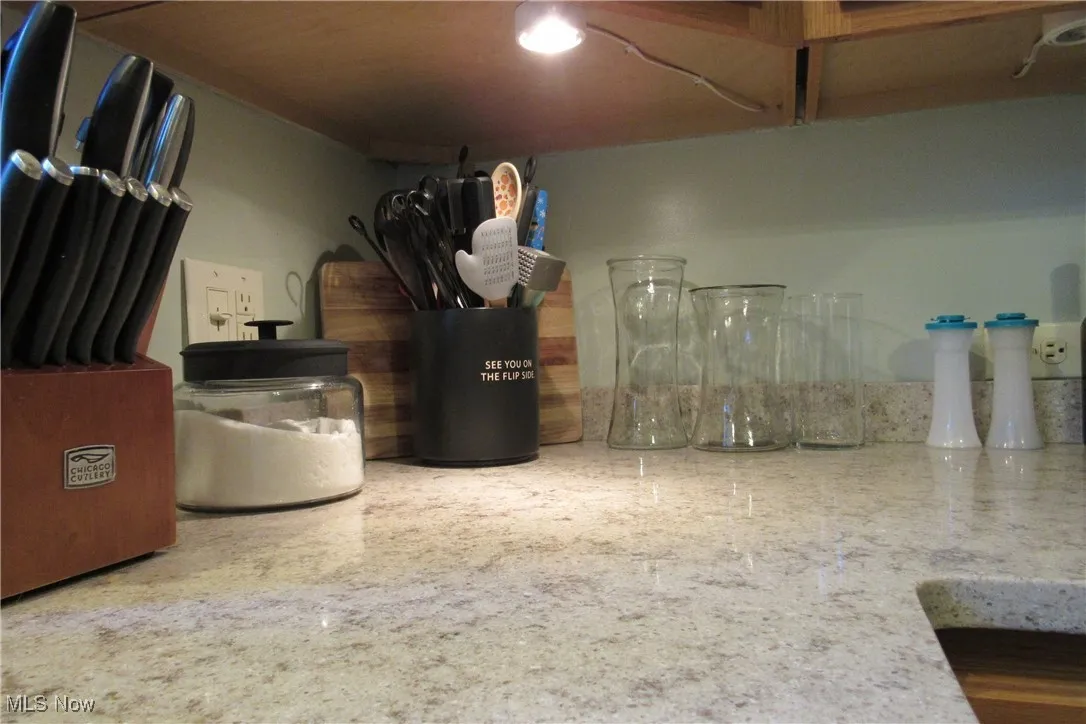 Attractive Quarz counters & under cabinet lighting.
