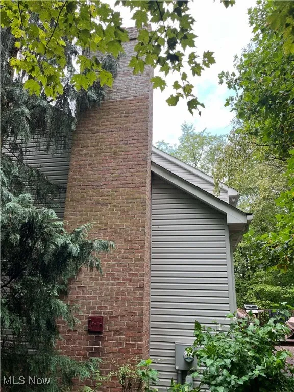 View of side of property with brick siding