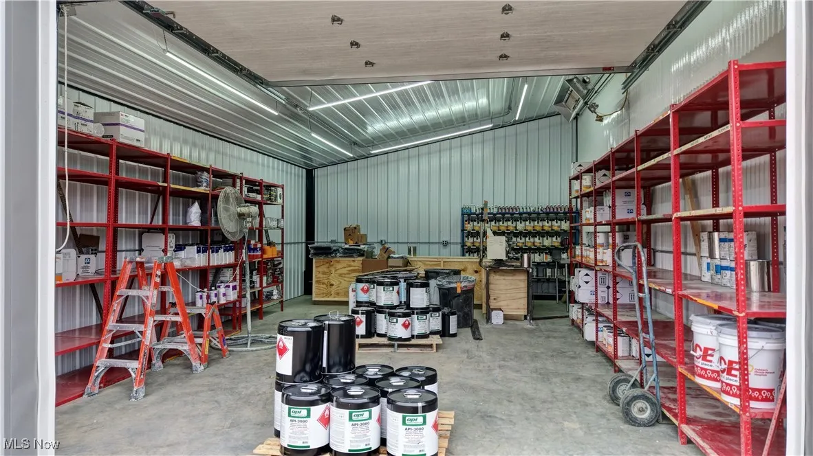 Garage featuring metal wall