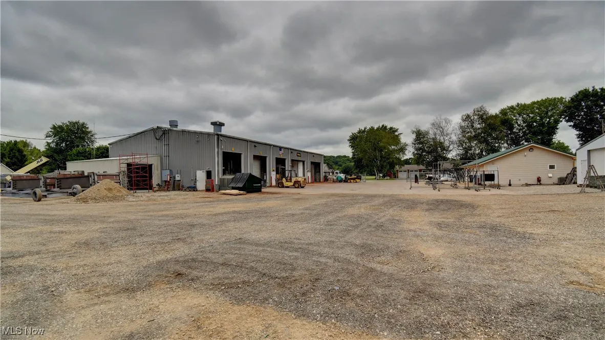 View of yard with an outbuilding and a pole building