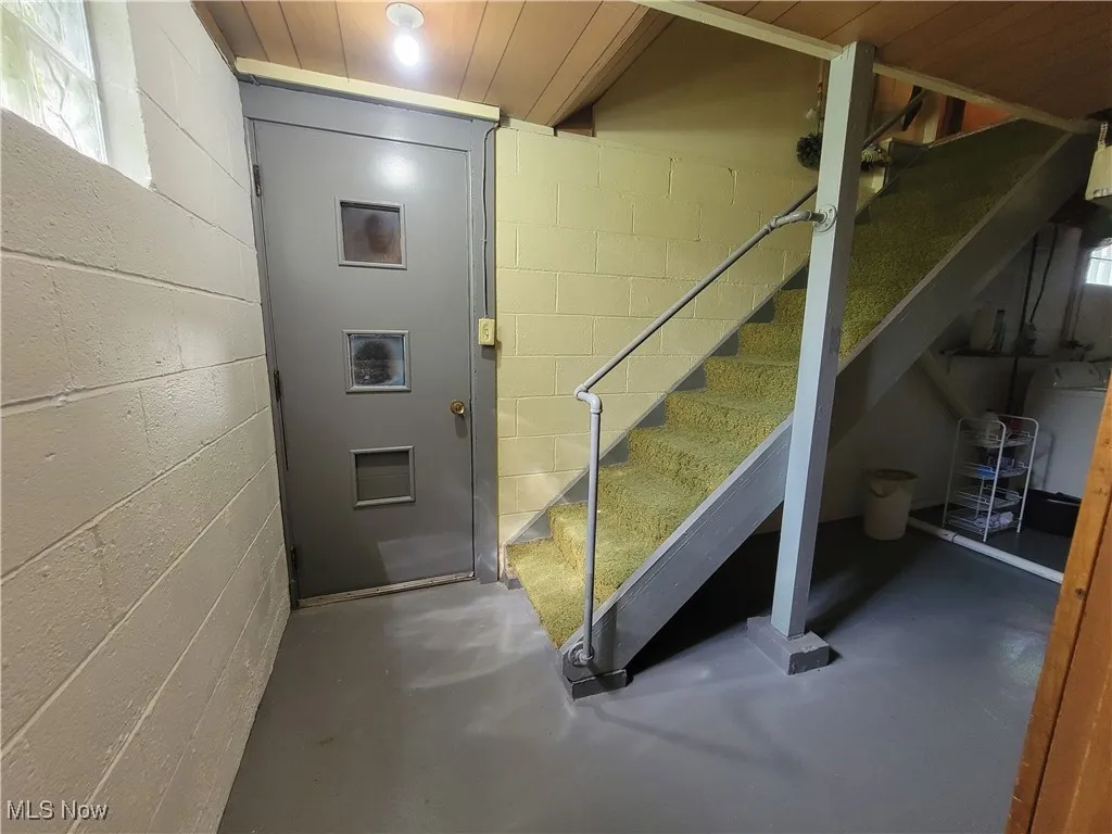 Basement with stairway and plenty of natural light