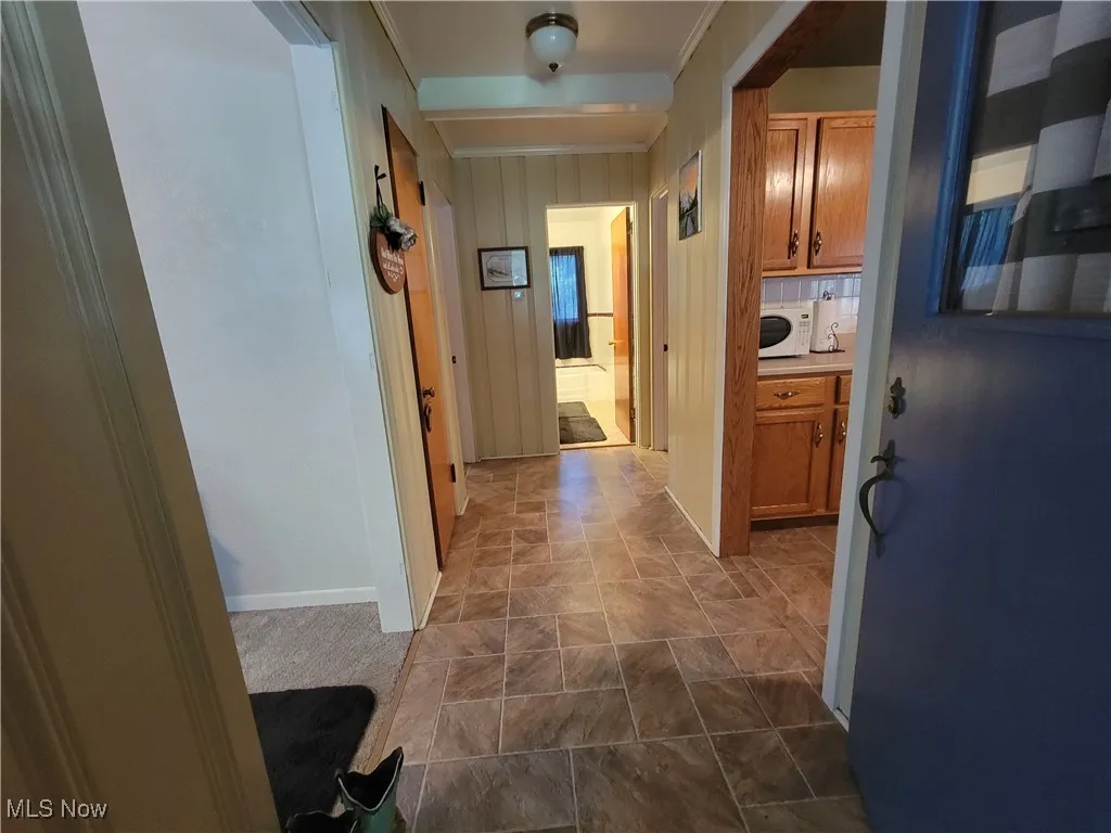 Hall featuring baseboards