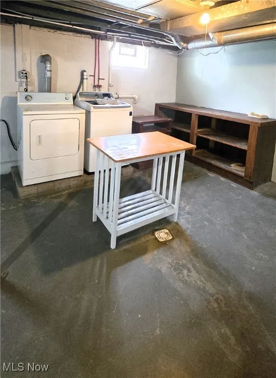 Basement featuring washing machine and clothes dryer
