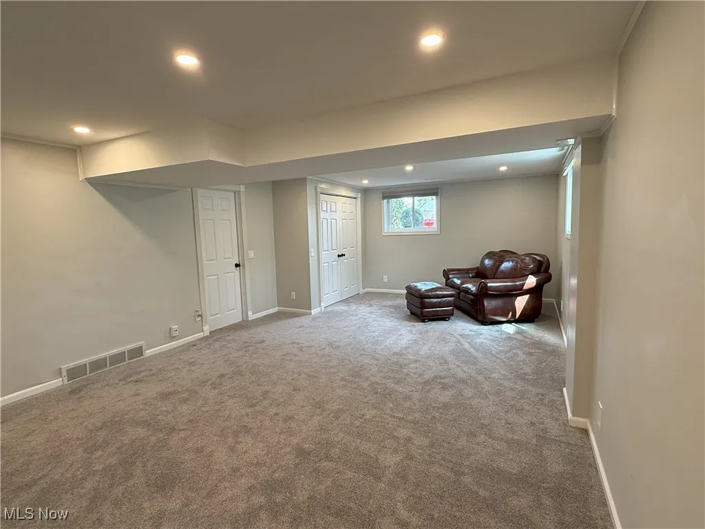 Sitting room featuring carpet and recessed lighting