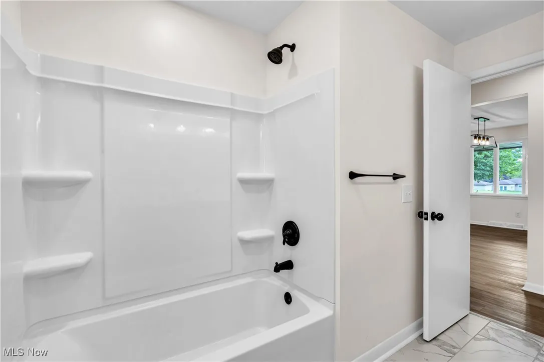 Bathroom with shower / bath combination