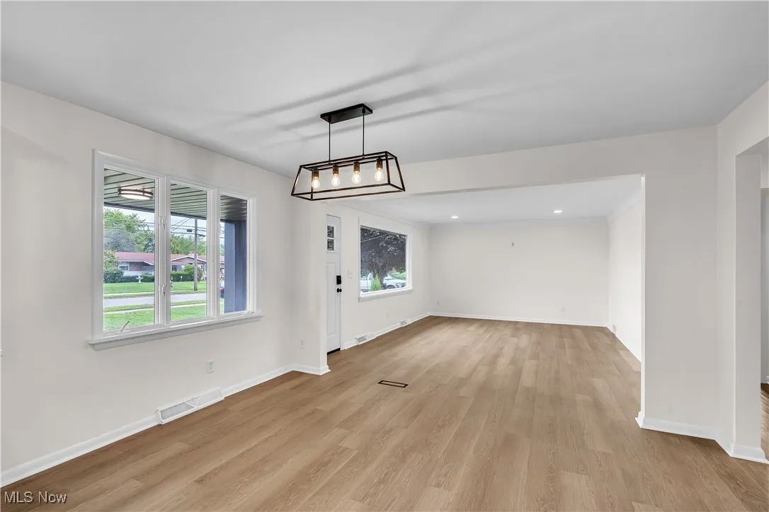 Dining area featuring light wood-style flooring and recessed lighting