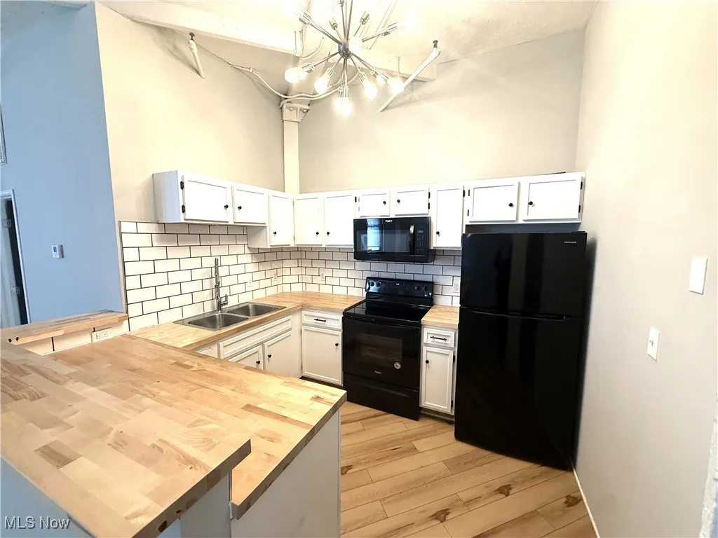 Bedroom with baseboards and light wood-style floors