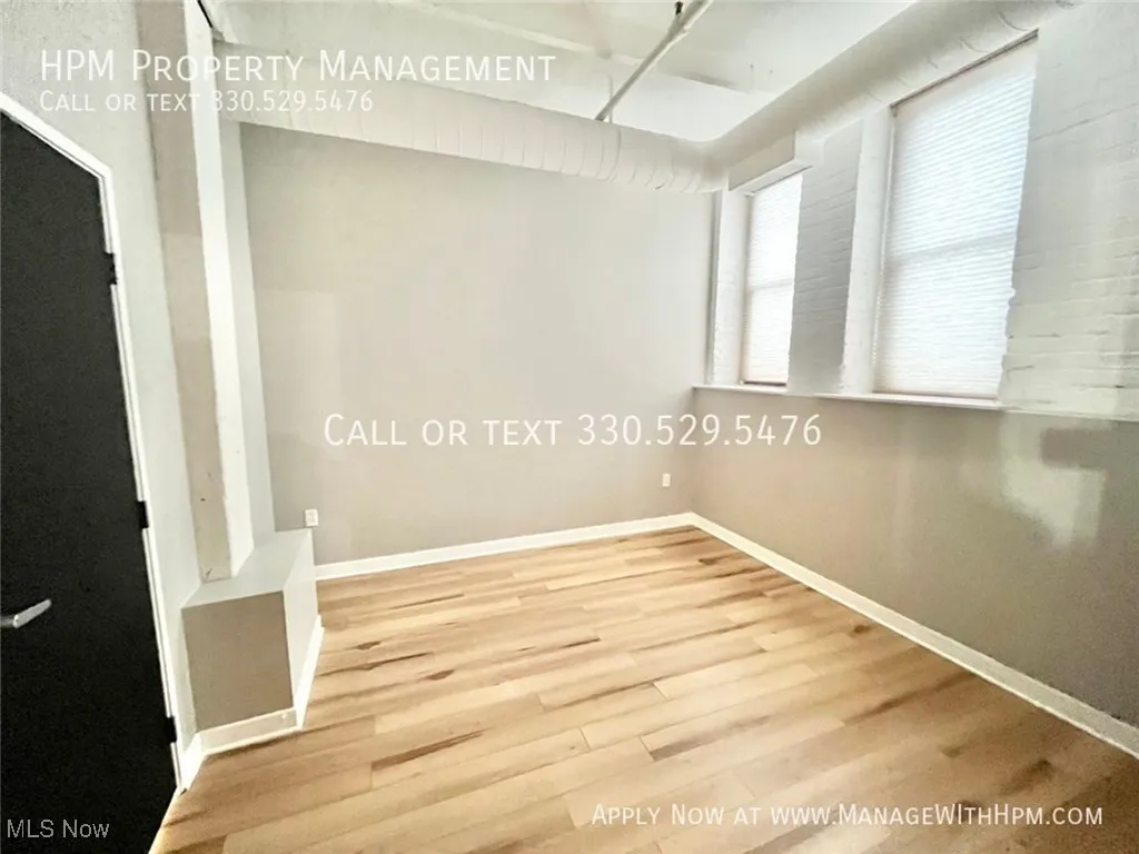 Empty room with light wood-type flooring