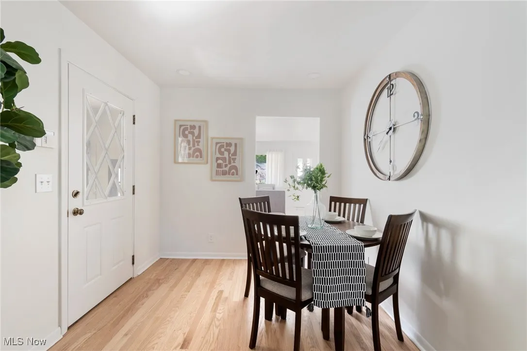 Dining space featuring light wood-style flooring and recessed lighting