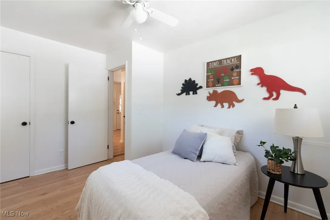Bedroom featuring light wood-type flooring and ceiling fan
