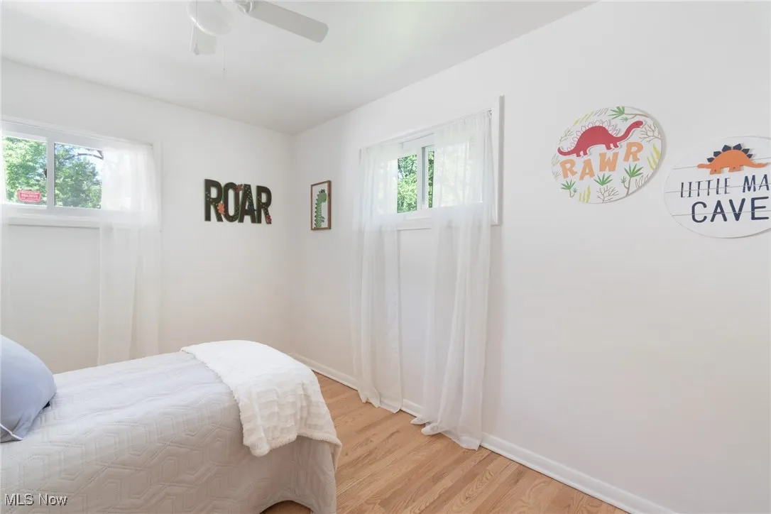 Bedroom featuring light wood-type flooring and a ceiling fan