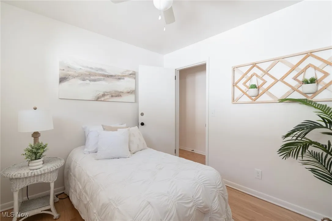Bedroom featuring light wood-style floors and ceiling fan