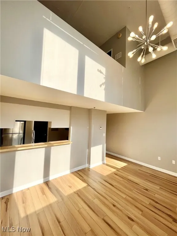 Living room with brick wall and light wood finished​​‌​​​​‌​​‌‌​‌‌​​​‌‌​‌​‌​‌​​​‌​​ floors