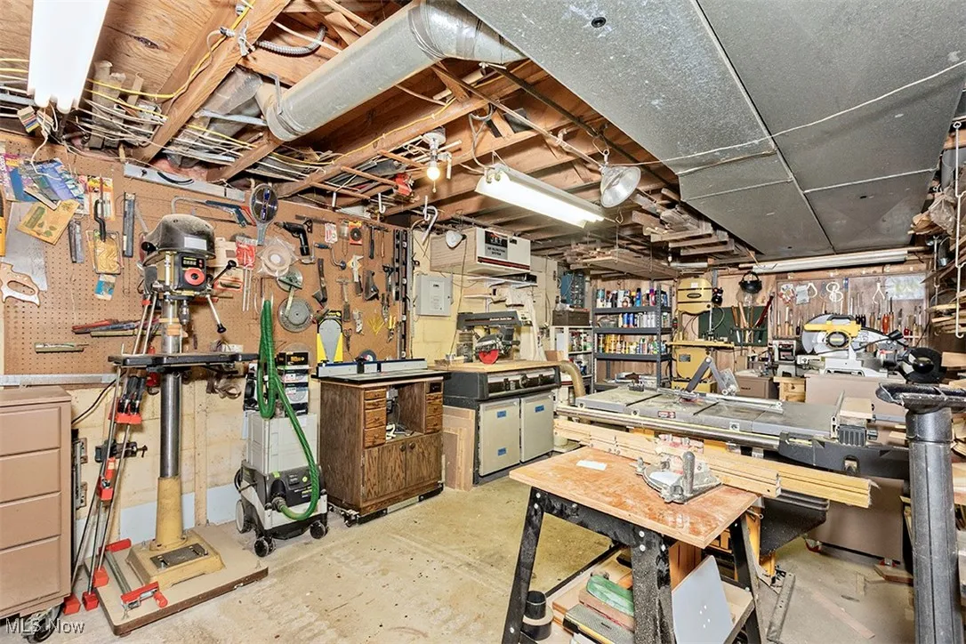 Unfinished basement with a workshop area