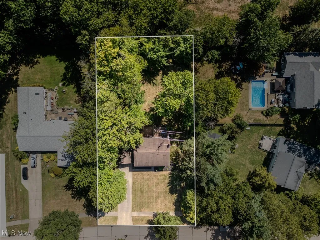 View of property location featuring property parcel outlined and a pool area