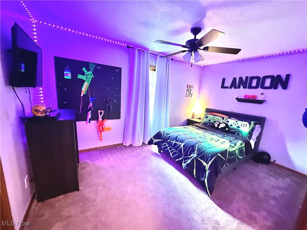 Bedroom featuring carpet flooring and ceiling fan