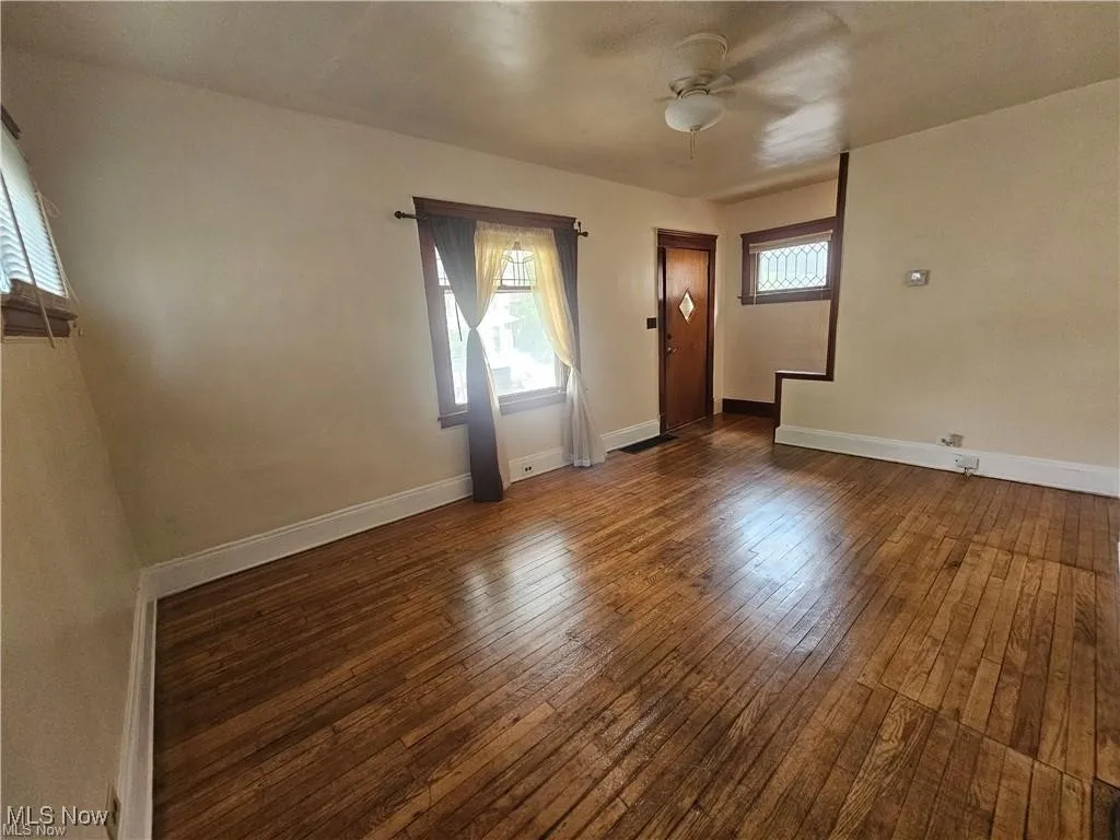 Living Room showing front door and staircase