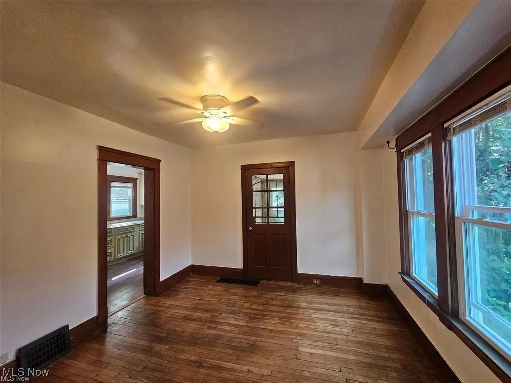 Dining Room leading to living room. Also rear door to small patio