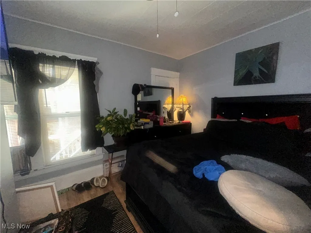 Bedroom with wood finished floors