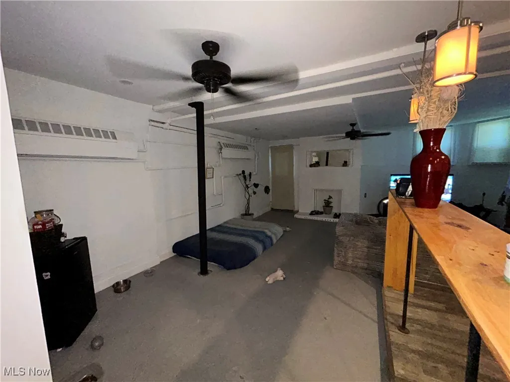 Basement with a ceiling fan