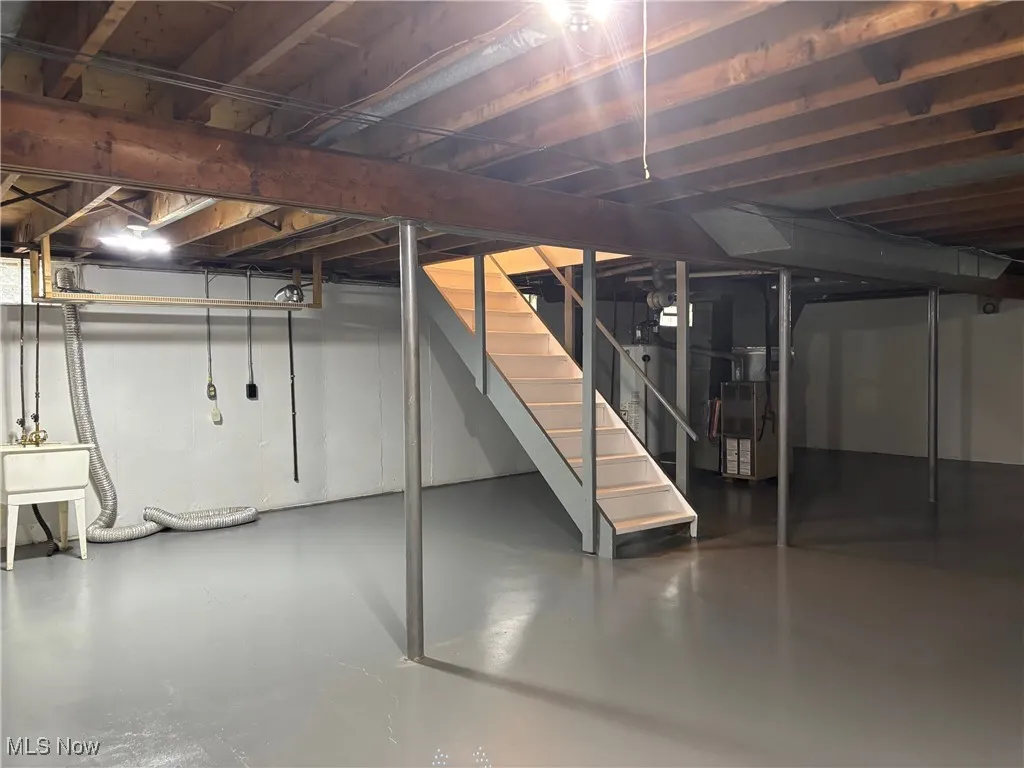 Unfinished basement with stairway