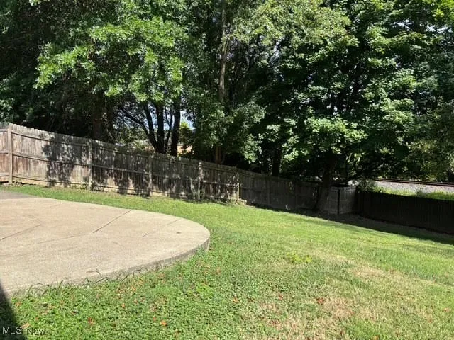 Fenced backyard featuring a patio area
