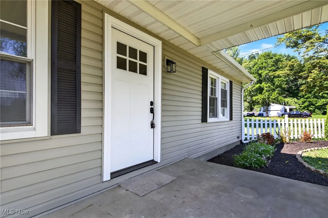 Entrance to property with a porch