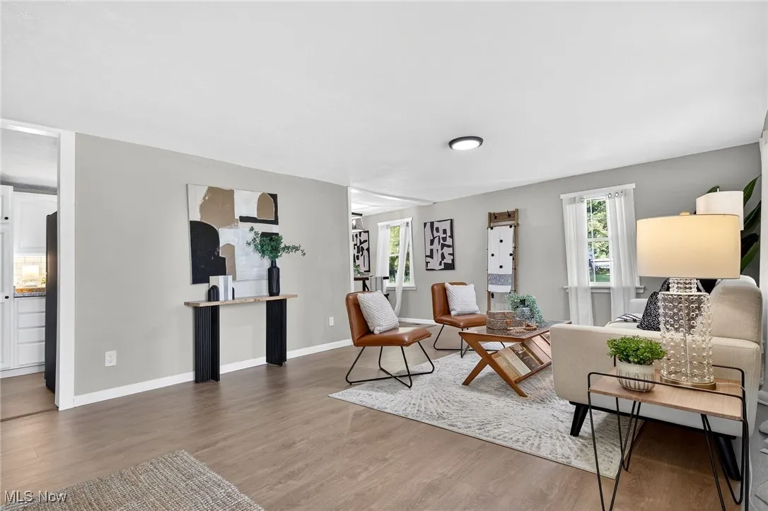 Living room with wood finished floors and baseboards