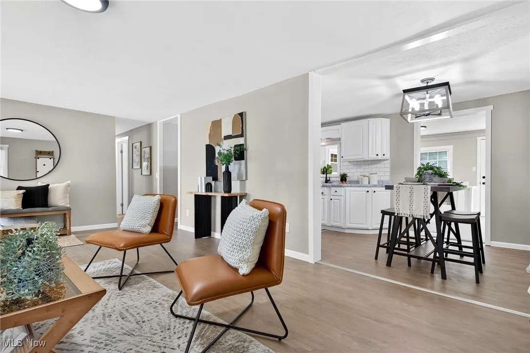 Sitting room featuring light wood finished floors and baseboards