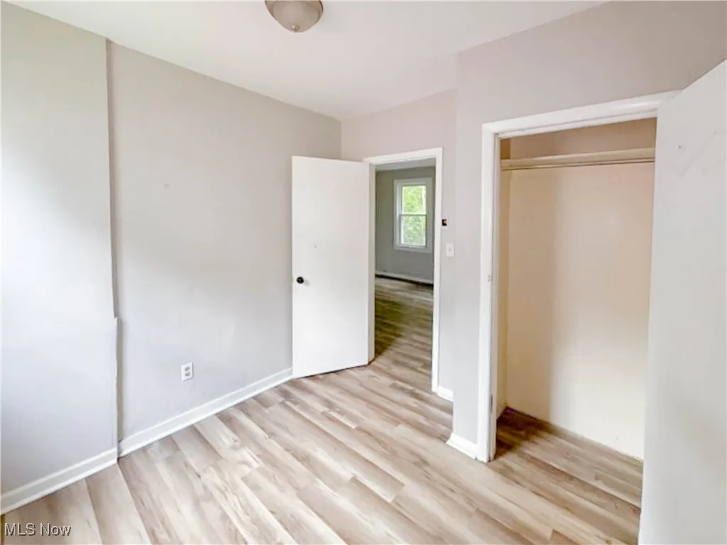 Unfurnished bedroom featuring a closet