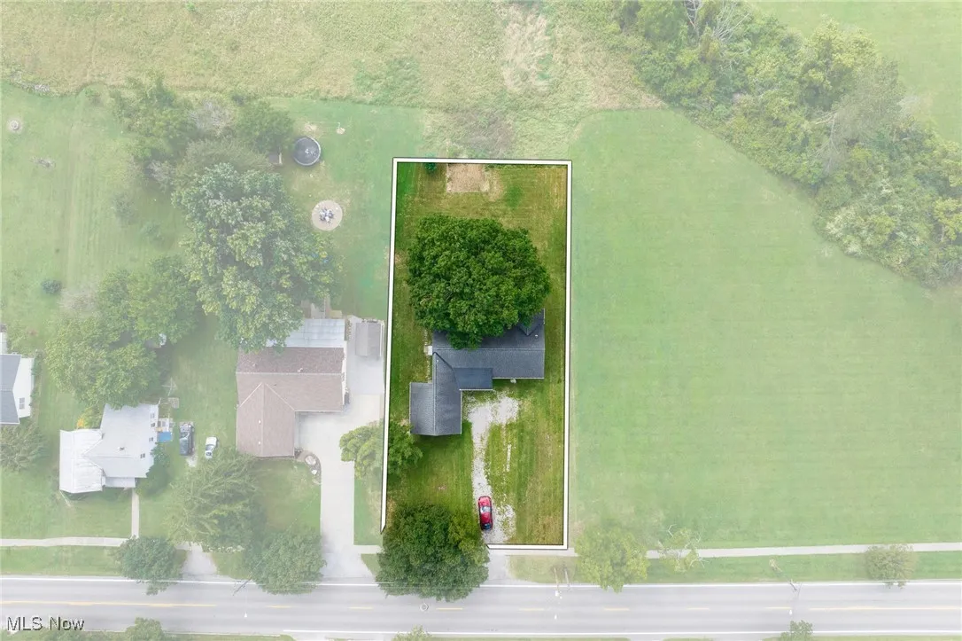 Aerial overview of property's location featuring property parcel outlined