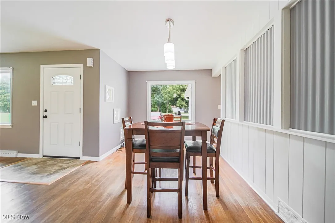 Dining area featuring light wood-style floors and plenty of natural light