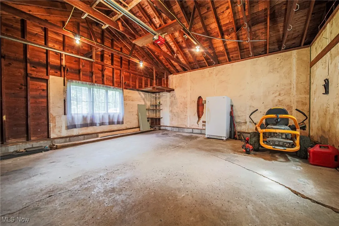 Garage with freestanding refrigerator
