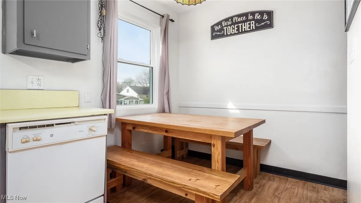 Dining room featuring light wood finished floors and baseboards
