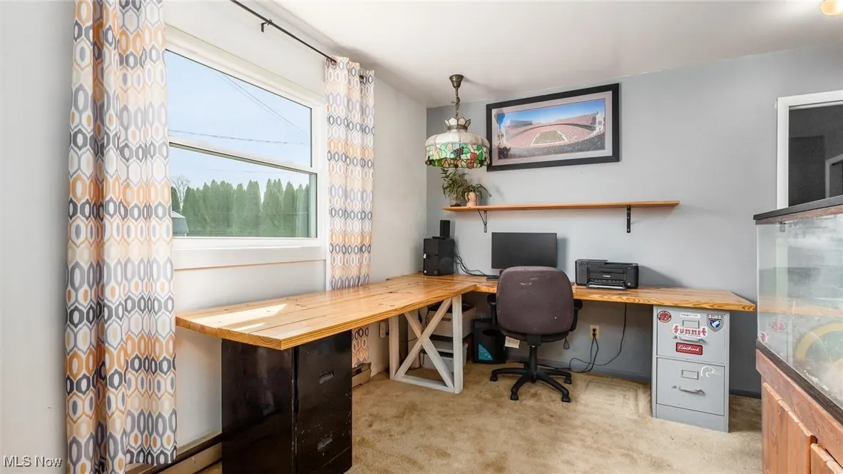 Office area featuring light colored carpet