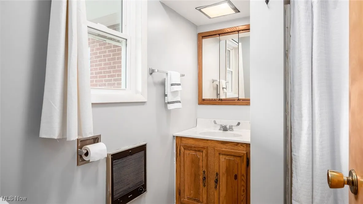 Bathroom with vanity and heating unit