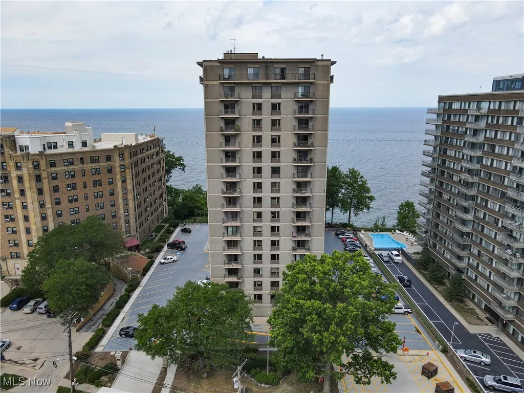 View of condo complex with a lake view